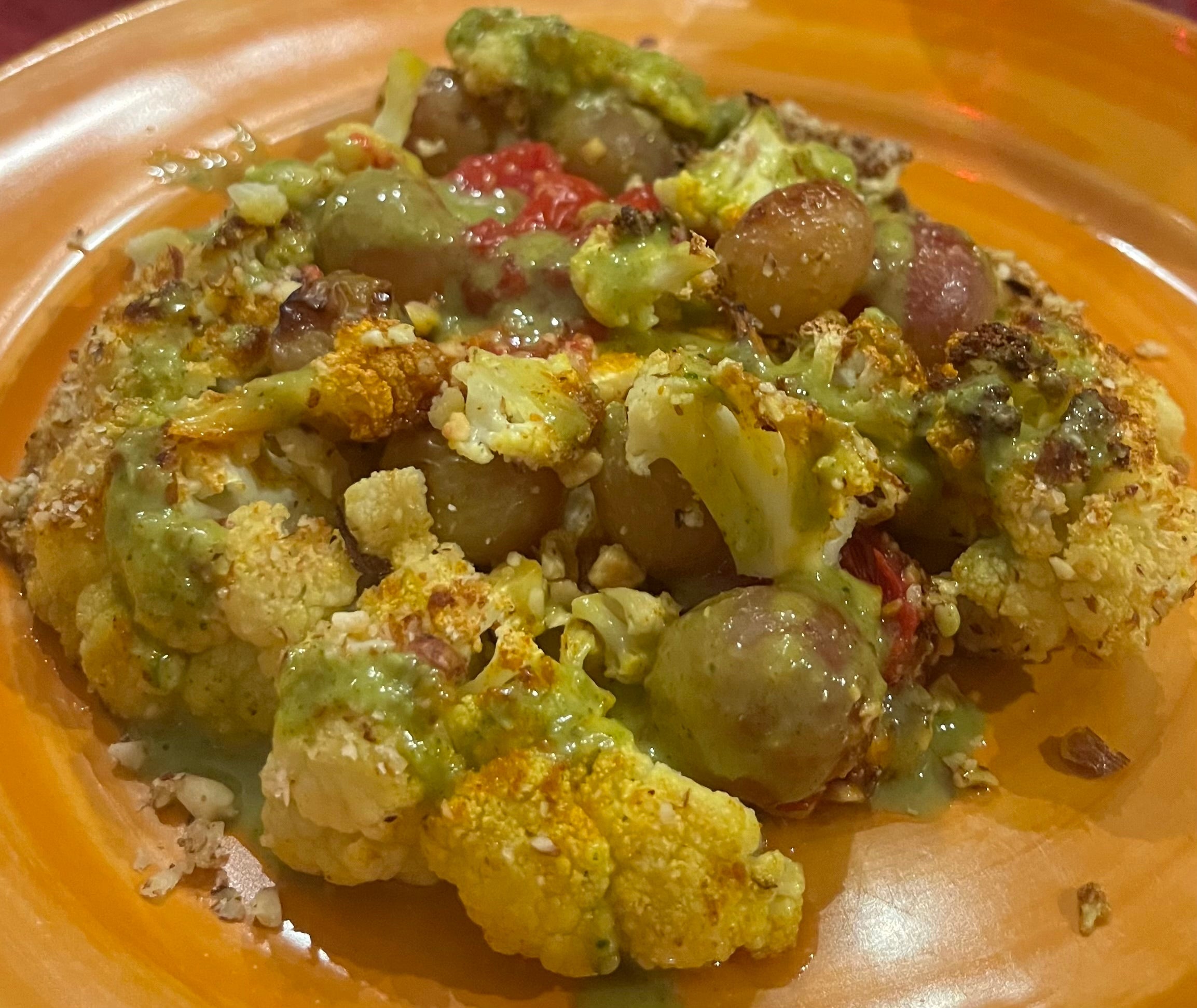Cauliflower Steaks With Tomatoes & Grapes from The Blue Zones Kitchen Cookbook "One Pot Meals: 100 Recipes to Live to 100" by Dan Buettner
