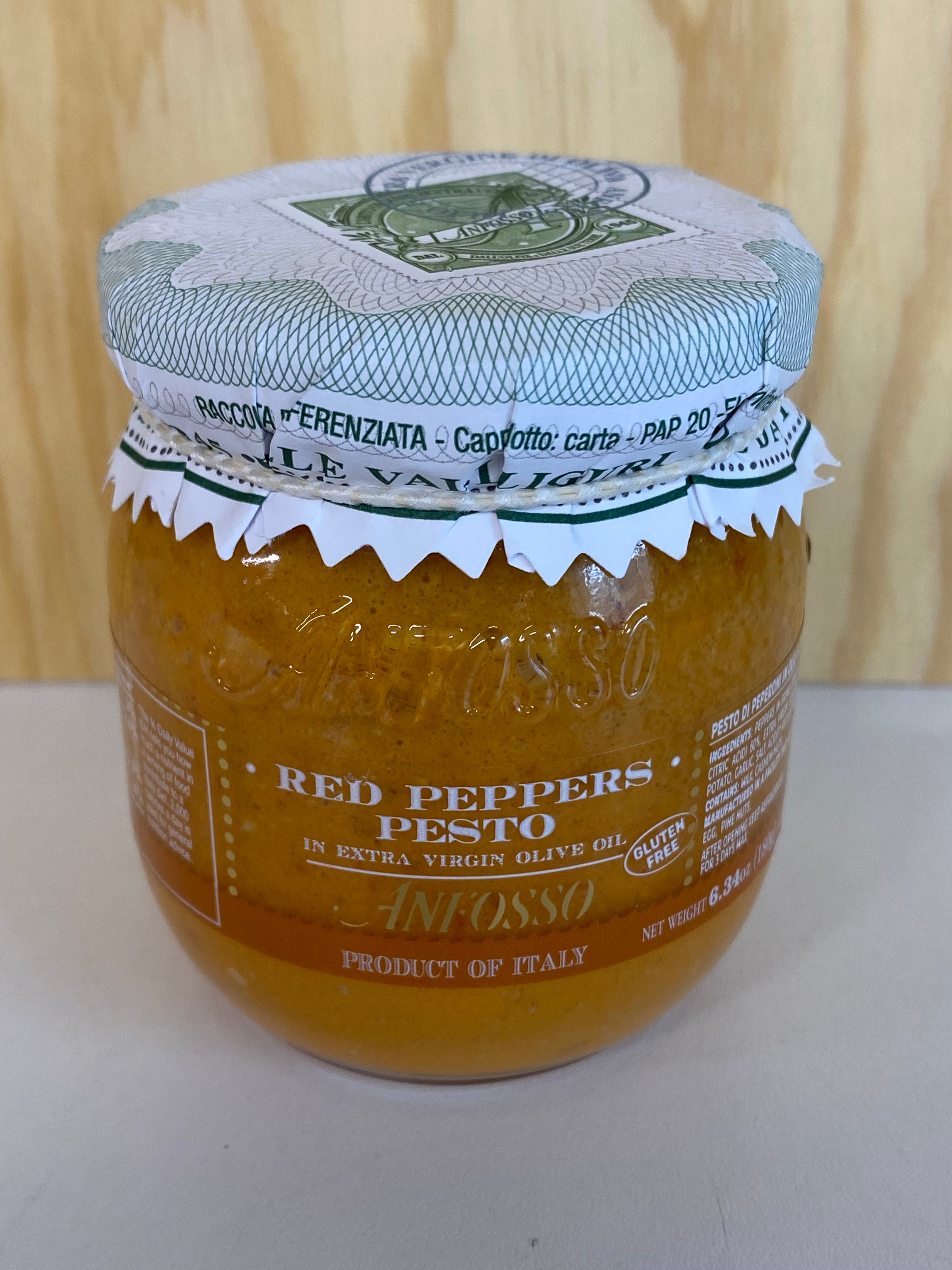 Jar of Anfosso red peppers pesto with a paper label on a white surface
